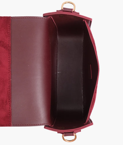 Burgundy suede saddle bag with twist lock